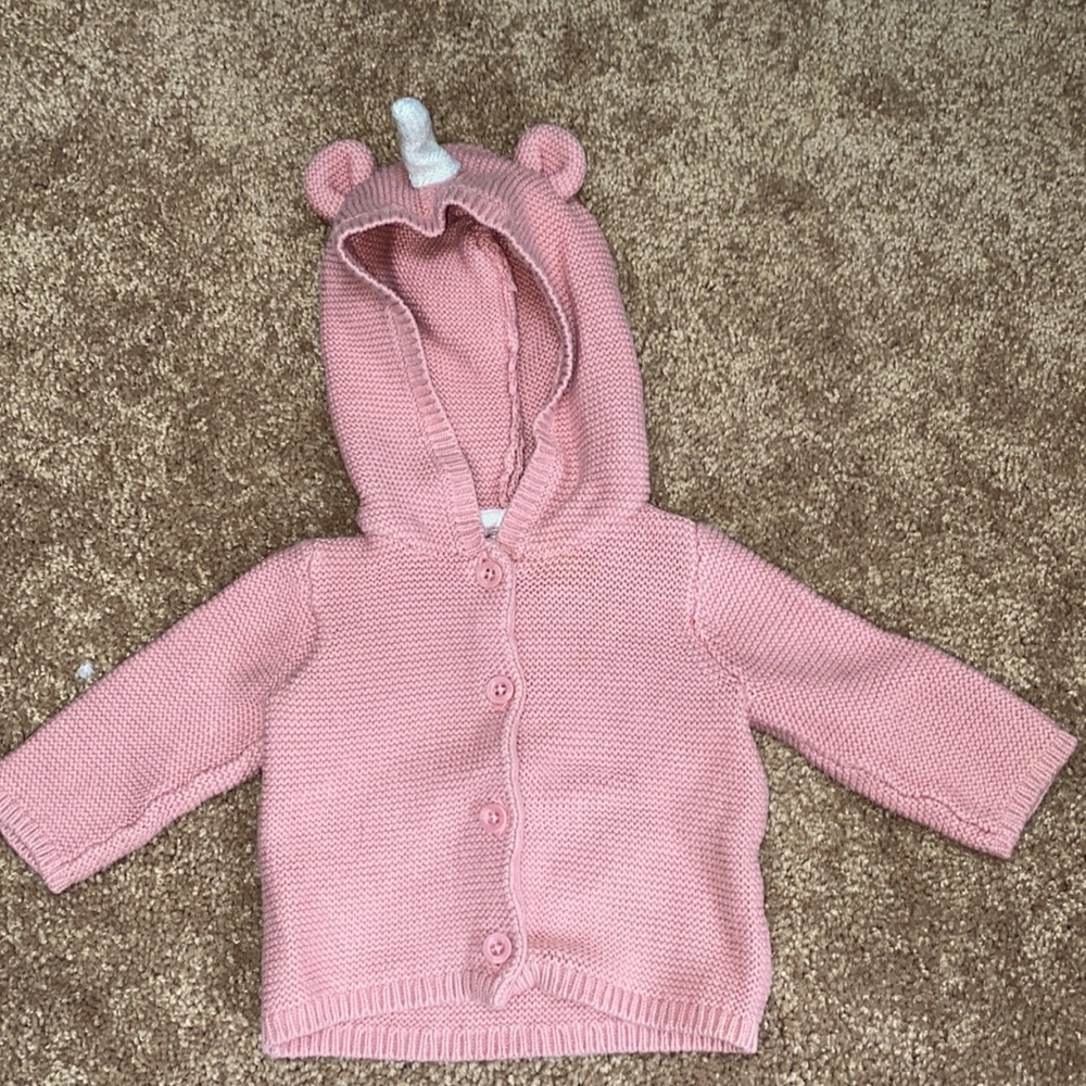 Pink sweater with unicorn hood